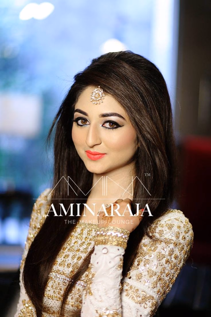 Who owns Amina Z Salon?