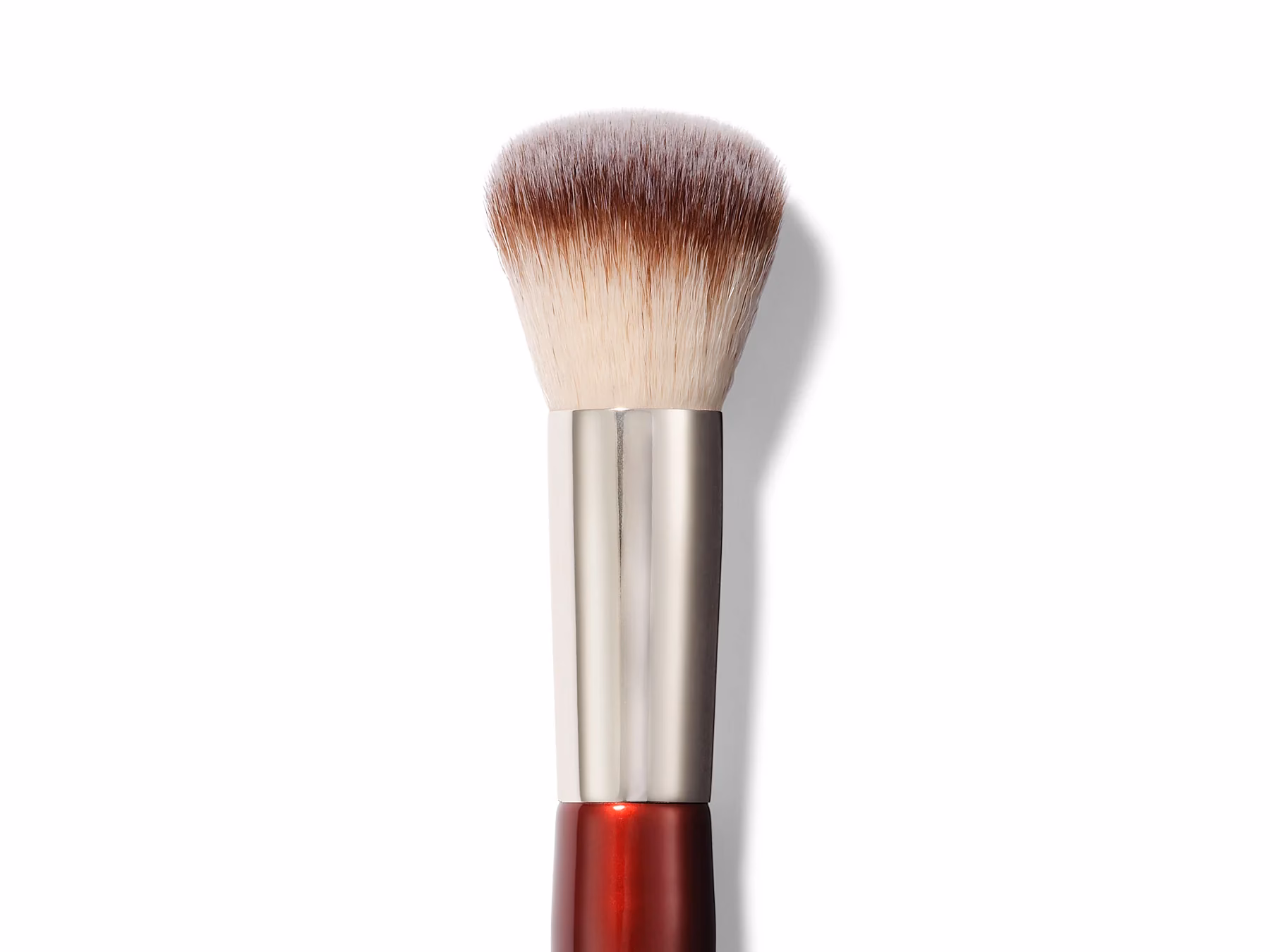 What is a curved makeup brush used for?