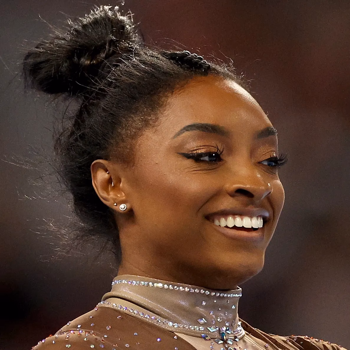 Why do gymnasts wear false lashes?
