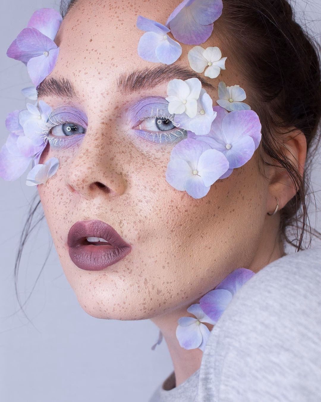 Who owns the flower makeup brand?