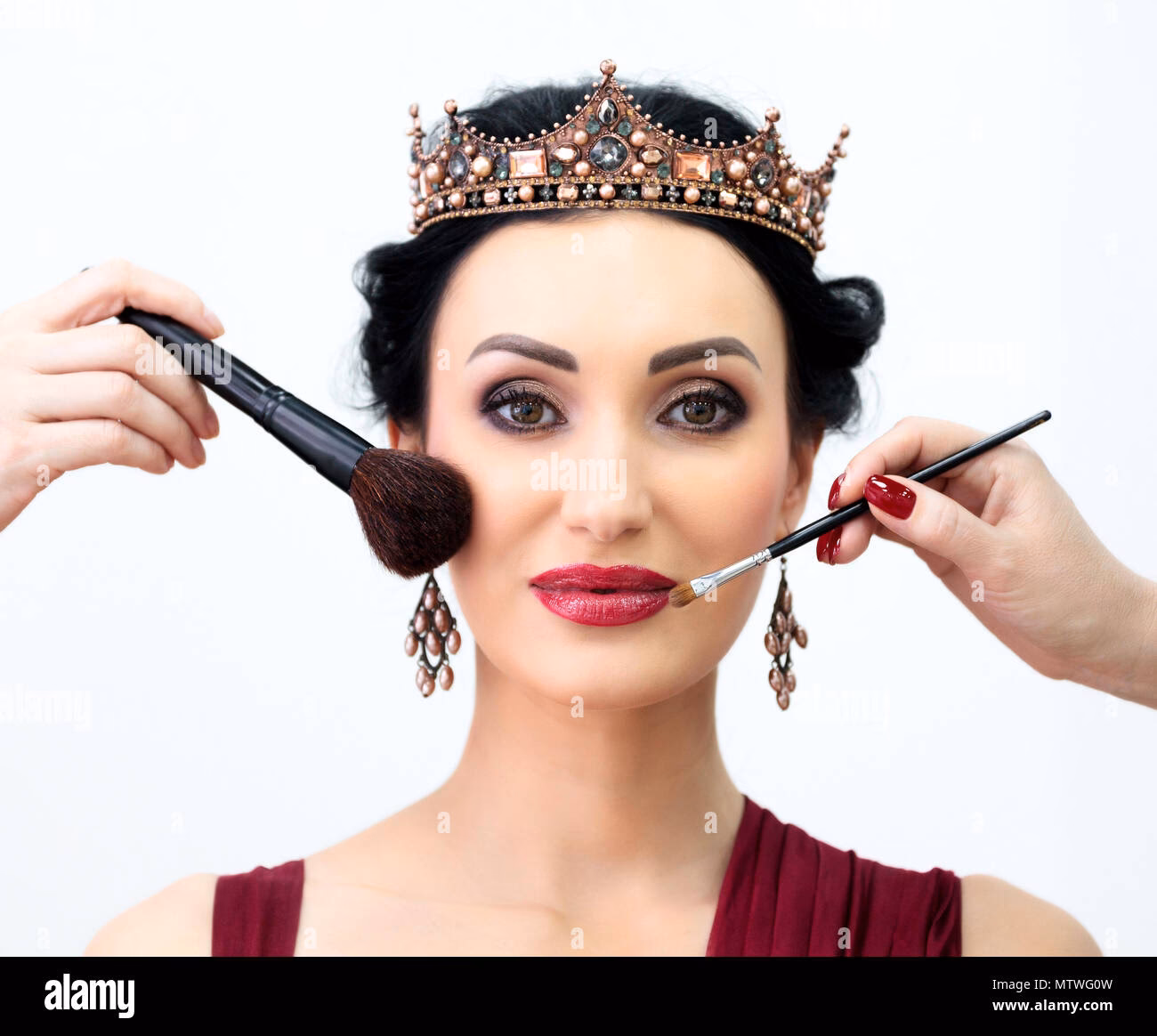 Who does the queens makeup?