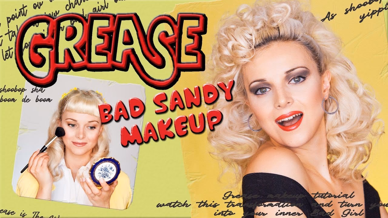 Does Sandy wear red lipstick?