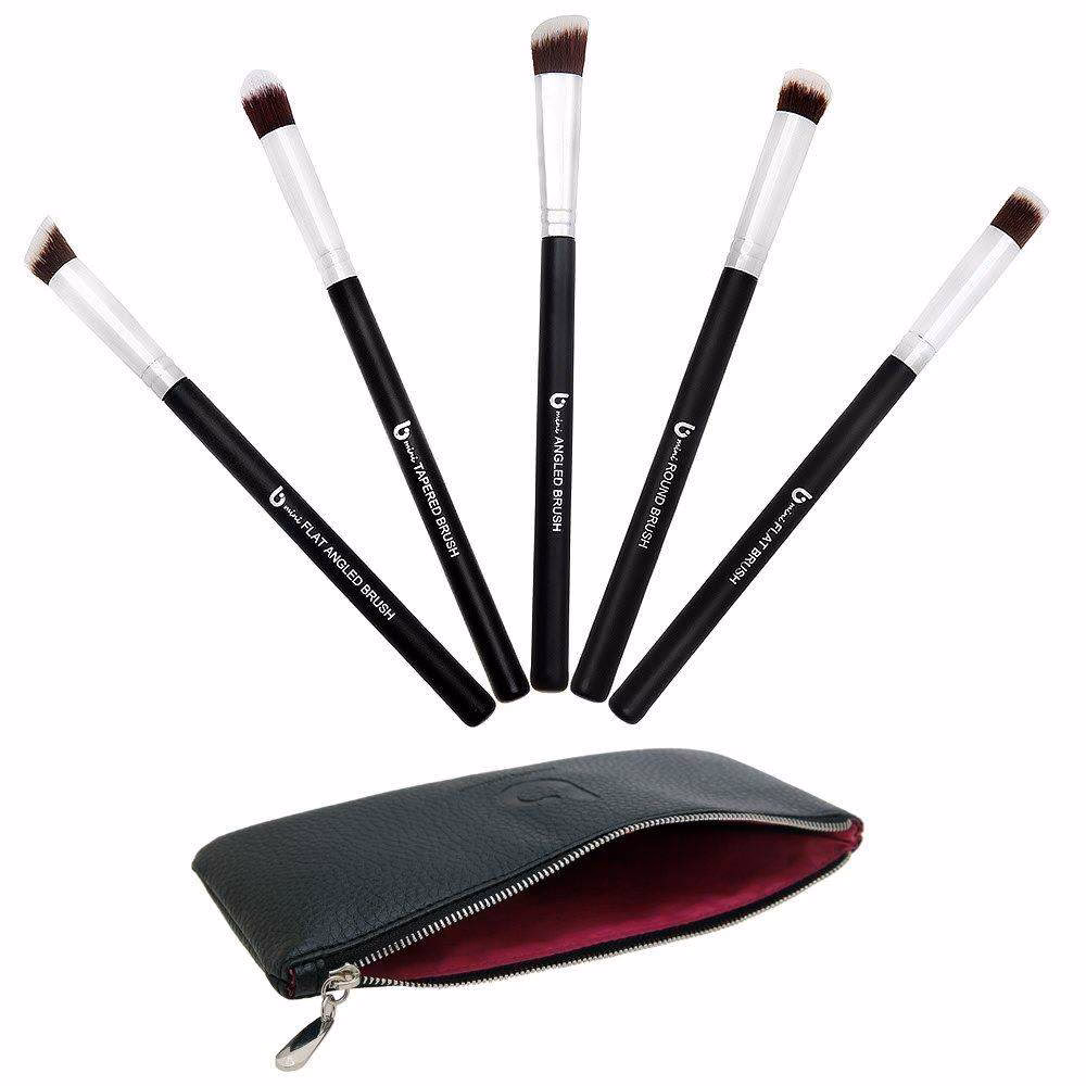 What is a small flat makeup brush used for?