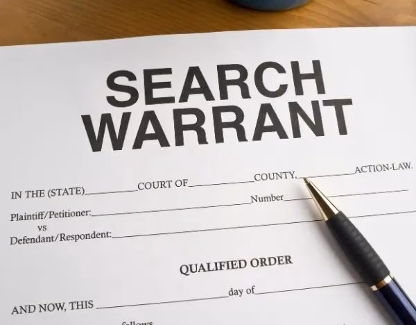 Can I turn myself in if I have a warrant?