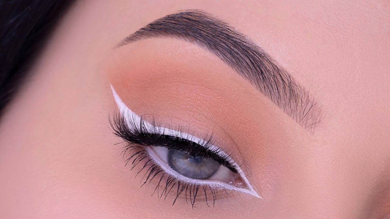 Why do girls put white makeup in the corner of their eyes?